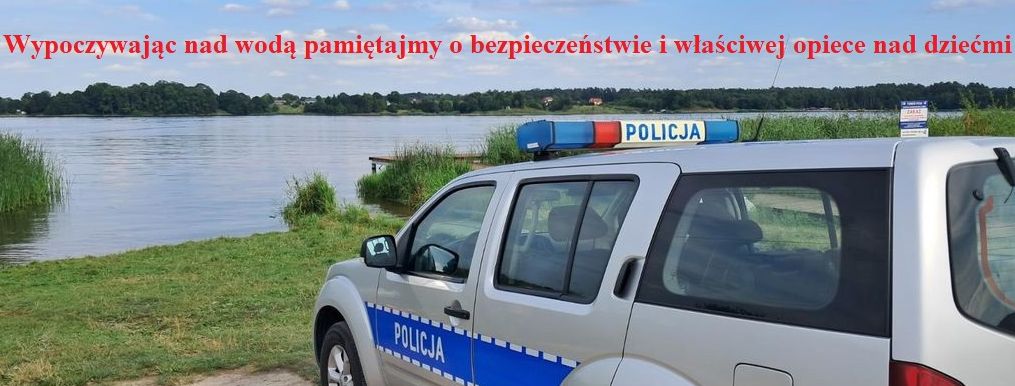 radiowóz nad zbiornikiem wodnym 