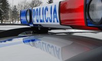 policyjny kogut z napisem Policja