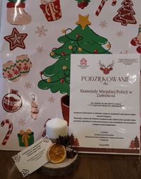 stroik świąteczny i list podziękowanie dla policjantów za udział w akcji